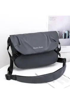 Men's dark gray oxford cloth messenger bag detailed view showing adjustable strap and buckle.