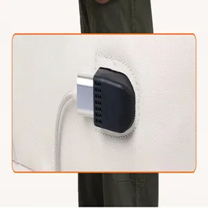 Close-up view of the external USB charging port and durable fabric details on the backpack.
