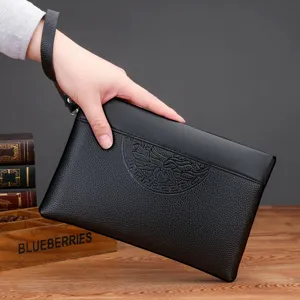 Black PU leather men's clutch bag with wrist strap and embossed front pattern main view.