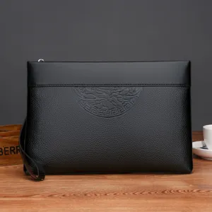 Stylish black mens clutch bag with embossed design, portable zipper and convenient wrist strap.
