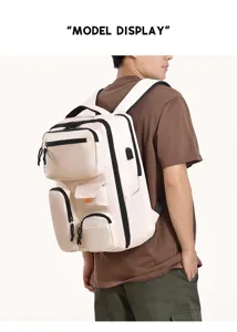 Detail view of the beige multi-pocket commuter laptop backpack worn by a male model.