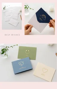 Minimalist gold foil greeting cards with envelopes, featuring elegant blessing texts and icons.