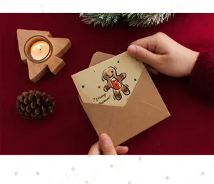 Vue détaillée de la carte de vœux de Noël vintage avec illustration de bonhomme en pain d'épices.