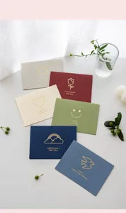 Minimalist gold stamped greeting cards with envelopes for birthday and holiday wishes.