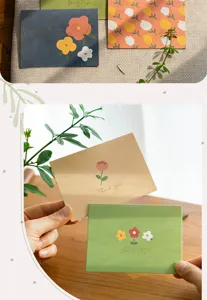 Detailed view of aesthetic greeting cards with floral print and gold foil text, perfect.