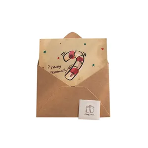 Ensemble de cartes de vœux de Noël vintage avec enveloppe kraft et joli design de canne à sucre.
