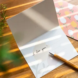 Fresh gold-stamped greeting card with tulip envelope and pen for birthday and festival gifts