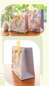 Sac cadeau en papier fleuri avec ruban, idéal pour emballer des cadeaux de fête.