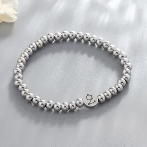 Detailed view of the stainless steel bead bracelet showcasing the engraved zodiac pendant design.