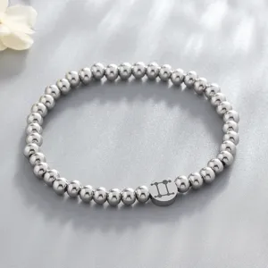 Stainless steel beaded bracelet with Gemini zodiac sign charm for women, chic jewelry.