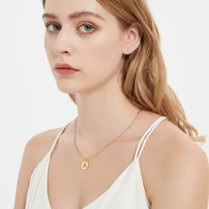Gold stainless steel letter A pendant necklace minimalist clavicle chain jewelry detail.