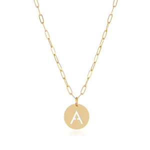 Gold stainless steel letter pendant necklace detail showcasing the cutout initial.