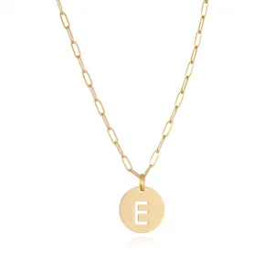 Close-up detail of the gold stainless steel cutout letter E pendant on a stylish paperclip chain.
