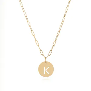 Detailed view of the gold-tone stainless steel chain necklace featuring a cut-out letter K pendant.