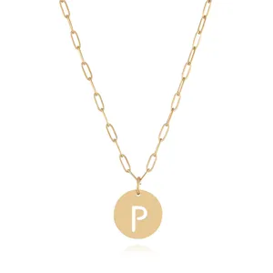 Gold paperclip chain necklace featuring a round pendant with cutout letter P detail.