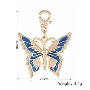 Colgante de mariposa de cobre bañado en oro con esmalte azul para hacer joyas DIY.