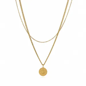 Close-up detail view of double layered gold stainless steel letter G pendant necklace