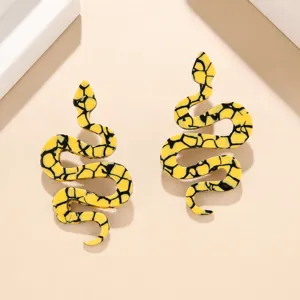 Detailed view of trendy yellow snake acrylic earrings with unique black pattern design.