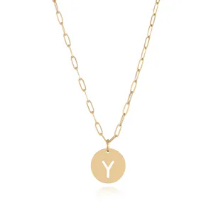 Detail view of gold stainless steel paperclip chain necklace with initial letter Y pendant.