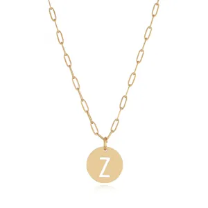 Detailed shot of gold stainless steel cutout letter Z pendant necklace, delicate link chain.