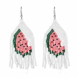 Handmade watermelon beaded fringe earrings detail view, colorful summer drop jewelry item.