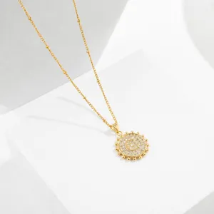 Gold-plated letter necklace featuring a sparkly zirconia-paved round pendant for women.