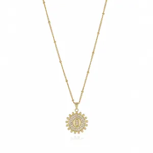Gold letter O pendant necklace with sparkling zirconia stones and delicate beaded chain detail.