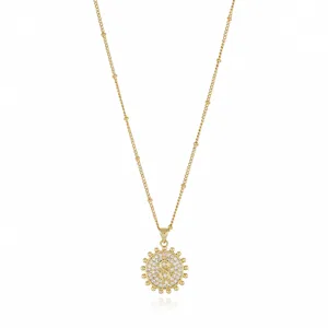 Gold-plated initial S pendant necklace featuring sparkling cubic zirconia sunburst design.