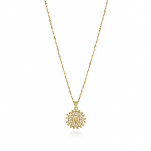 Detailed close-up view of a gold-plated initial W pendant necklace sparkling with zircon.