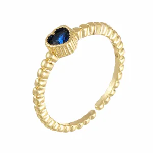 Gold color heart shaped blue zircon open ring detail, elegant jewelry accessory for women.