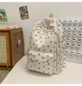 Cute strawberry print canvas backpack, multi-pocket school bag for students daily commute.