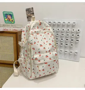 Cute cherry print canvas backpack for school girls, lightweight daily casual travel daypack.