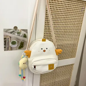 Cute cartoon chick crossbody bag for girls, sweet style adjustable shoulder bag with pendant.