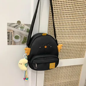 Cute black chick crossbody bag with yellow wings, sweet cartoon style canvas bag for girls.