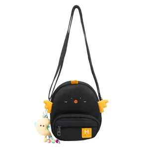 Cute black cartoon chick crossbody bag with yellow wings and plush pendant for daily use.