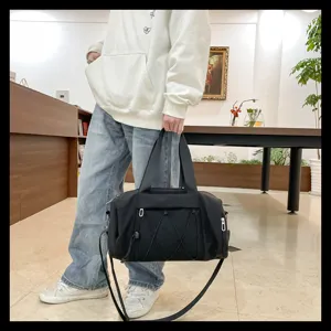Detailed view of black lightweight sports duffel bag, versatile large capacity gym travel bag.