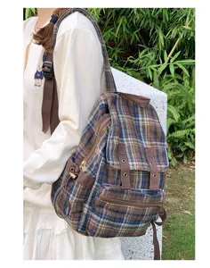 Japanese retro plaid backpack for women, casual versatile school bag for daily outdoor wear.