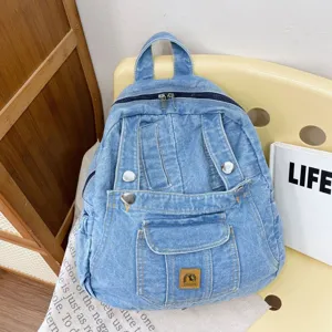 Vintage denim backpack for women, aesthetic casual campus school bag, stylish travel daypack.