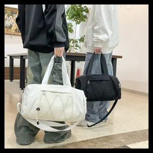 Close-up of lightweight sports gym duffel bag with mesh pocket and dual carry straps in lifestyle.
