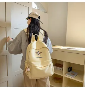 Casual canvas backpack with cute puppy embroidery, large capacity for daily travel.