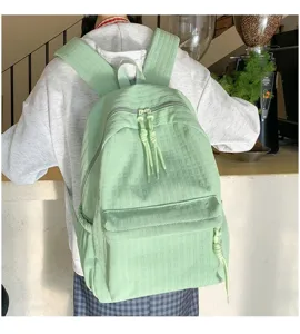 Sac à dos étudiant vert clair décontracté avec grande capacité pour les voyages et l'école.