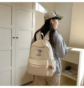 Casual canvas backpack for women and students with cute puppy embroidery, large capacity bag.