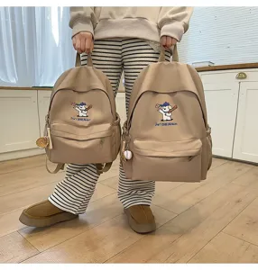Casual canvas backpack with cute puppy embroidery, large capacity school bag for students.