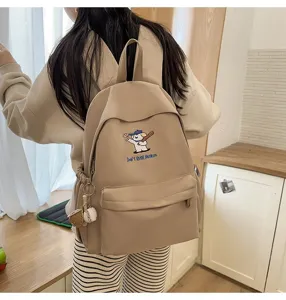 Large capacity beige canvas backpack for students, cute puppy embroidery design, casual travel daypack.