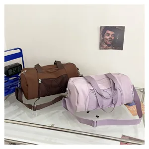 Detailed view of large capacity cylindrical fitness yoga sports duffel gym travel bag.