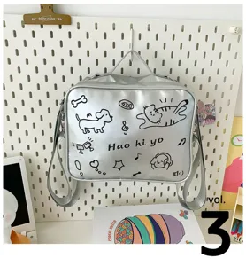 Cute silver cat doodle ita bag detail view, stylish shoulder design for college style.