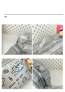 Silver cute cat embroidered ita bag detail view showing strap buckle, handle and zipper.