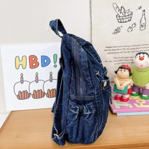 Vintage denim backpack for women, casual college style chic bookbag, daily commuter travel bag.