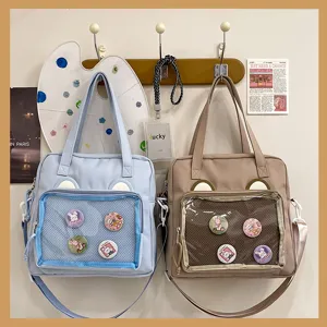 Cute canvas ita bag with clear window and pins for anime fans, large capacity daily shoulder bag.