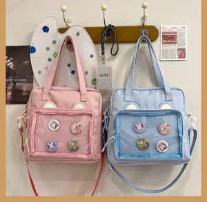 Cute ita bag canvas shoulder crossbody bag with transparent mesh pocket for pins and badges.